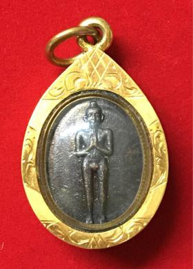 เหรียญเม็ดแตงไอ้ไข่วัดเจดีย์รุ่นแรก ปี 2546 วัดเจดีย์ จ.นครศรีธรรมราช เนื้อทองแดงพร้อมเลี่ยมกรอบทองคำ