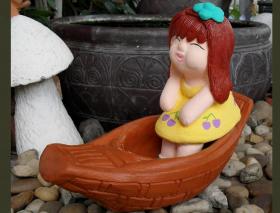 ตุ๊กตานั่งเรือ(งานหินทราย) 